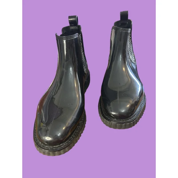Women's Michael Kors black patent Lulu PVC Chelsea boot with stud accents.